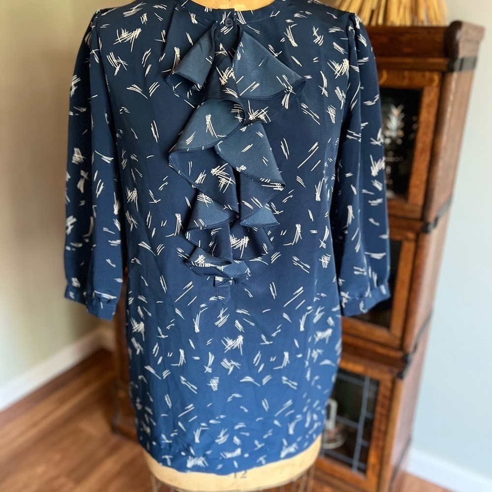 Anthropologie Silence and Noise blouse with half way down buttons and ruffles